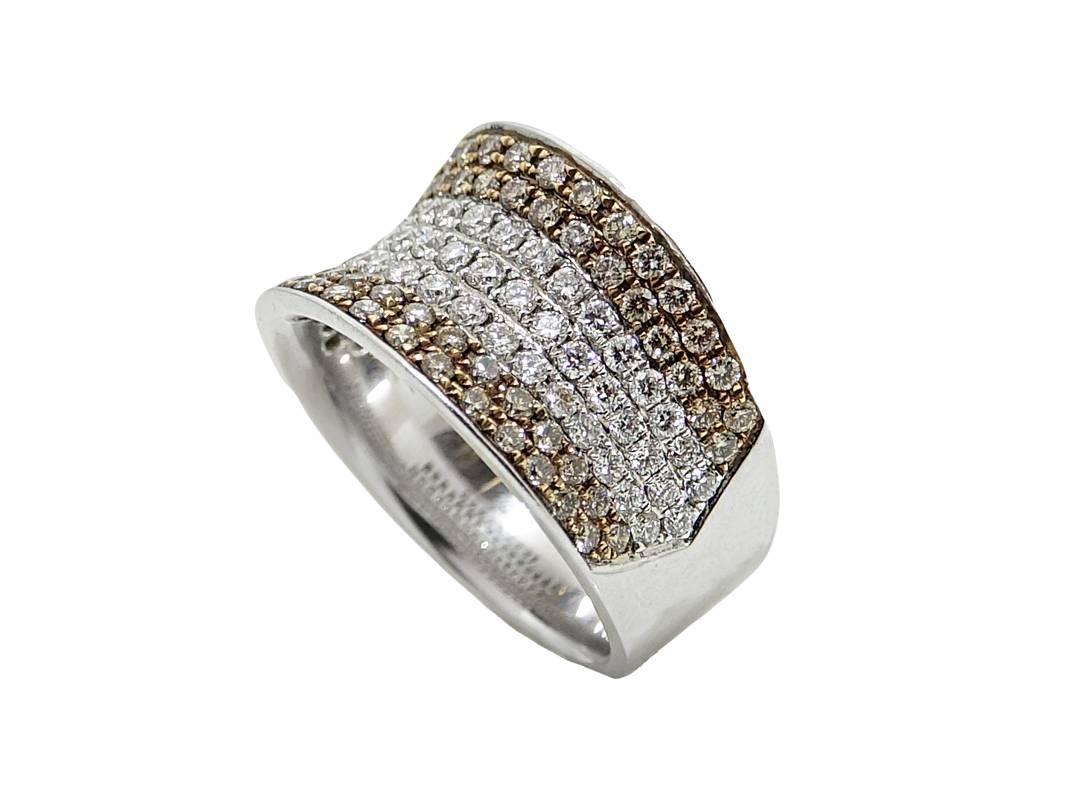18K White Gold Ring With Brown Diamonds Weighing A Total Carat Weight Of .74 Carats, and White Diamonds Weighing A Total Carat Weight Of .73 Carats. This Ring Is A Size 6 And Can Be Sized Upon Request.