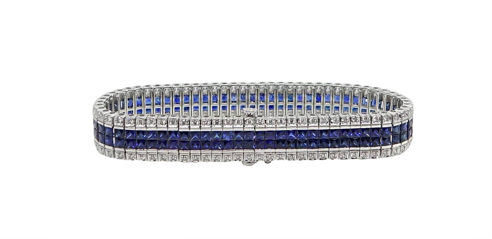 This 18K White Gold Bracelet Has Approximately 142 French Cut Blue Sapphires Weighing A Total Carat Weight Of 15.21 Carats, and Approximately 142 Round Diamonds Weighing A Total Carat Weight Of 1.53 Carats, G-H Color VS2-SI1 Clarity. This Bracelet