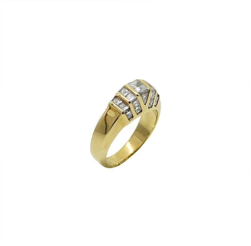 This 18K Yellow gold Ring Has Princess Cut and Triangle Cut Diamonds Weighing A Total Carat Weight Of 1.50 Carats. This Ring Is A Size 7 and Can Be Sized Upon Request.