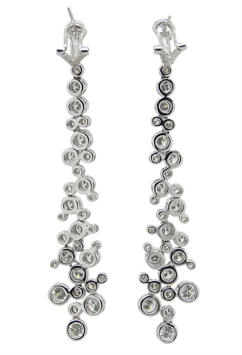 These 18K White Gold Buddle Drop Earrings Have Approximately 68 Round Diamonds Weighing A Total Carat Weight Of 4.99 Carats. These Earrings Are About 3 Inches In Length.