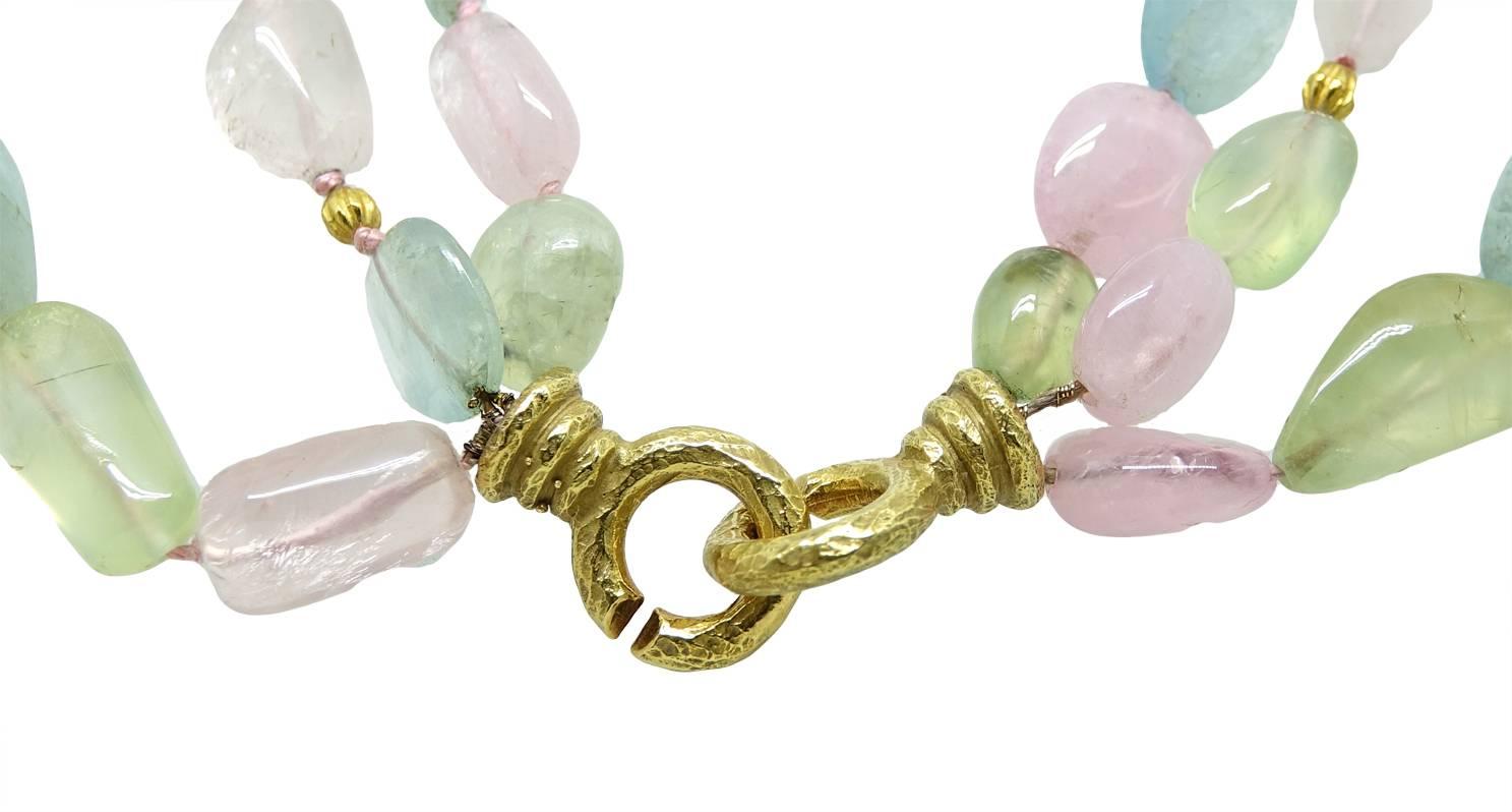This Colorful  Katy Briscoe 3 Strand Necklace has Aqua, Prehnite, And Rose Quartz Beads and has an 18K Yellow Gold Chinati Clasp. It Comes with the Original Embossed  Suede Pouch. This Necklace Is 18 Inches In Length.