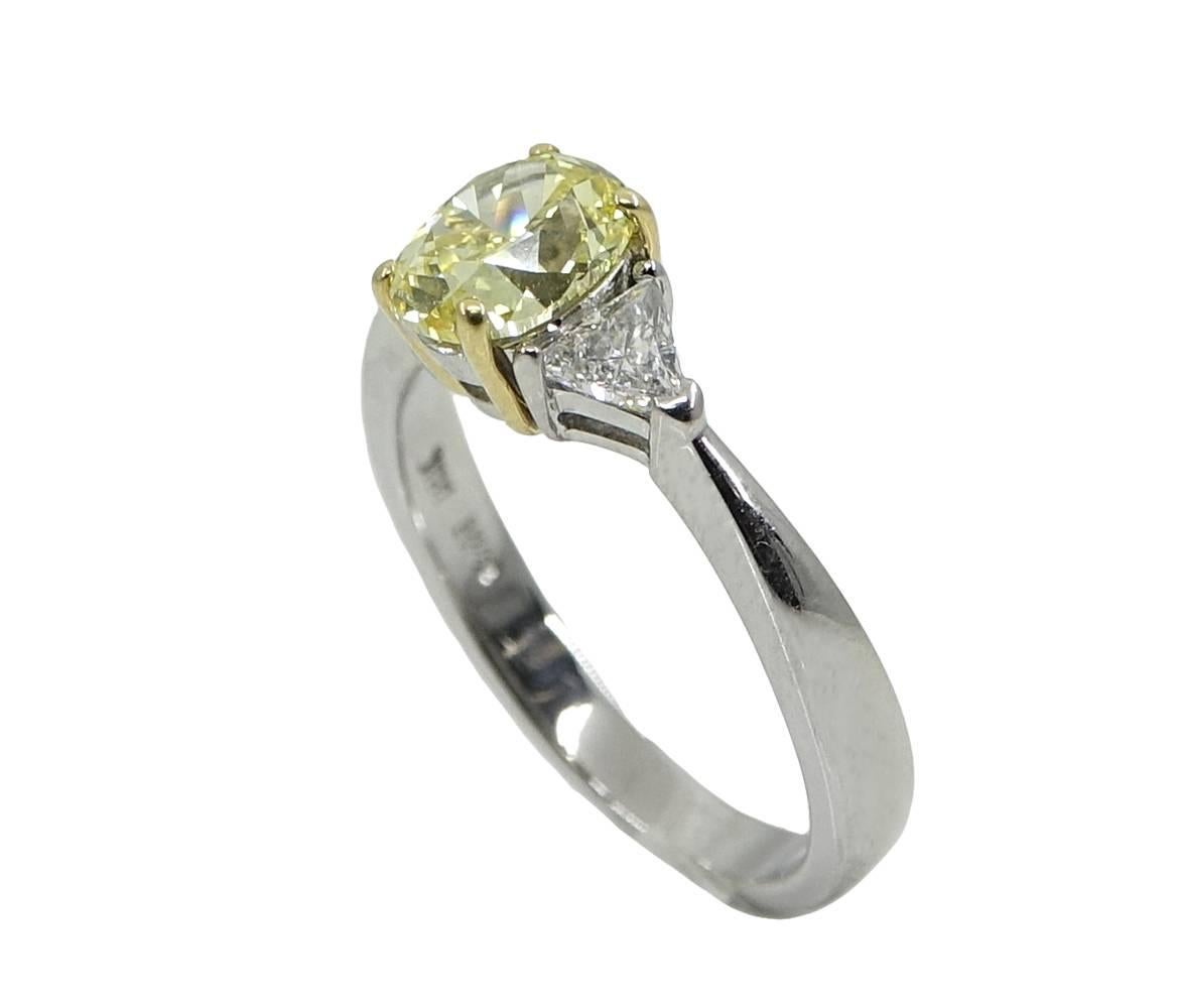 Oval Brilliant Fancy Intense Yellow Diamond Platinum Engagement Ring In Excellent Condition For Sale In Naples, FL