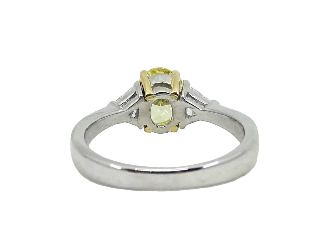 Oval Cut Oval Brilliant Fancy Intense Yellow Diamond Platinum Engagement Ring For Sale
