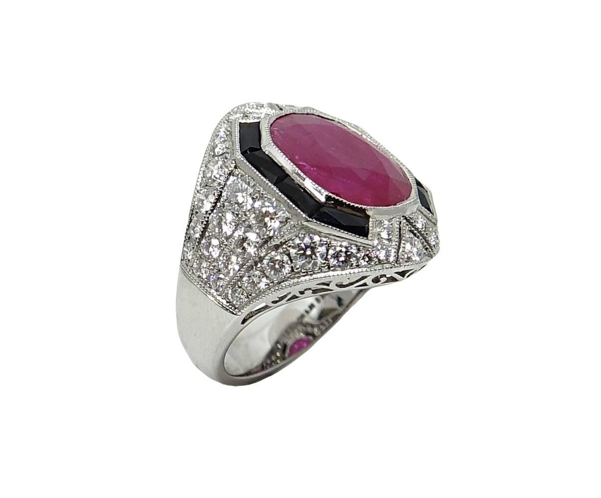 This Classic Style Platinum Ring Has A Center Cushion Cut Ruby Weighing A Total Carat Weight Of 5.72. (GAL Report #: 201603978) Round Diamonds Cover The Mounting Of The Ring and Weigh A Total Carat Weight Of 2.07 Carats, G-H Color and VS2-SI1 In