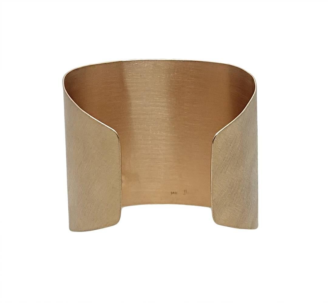 This Sleek and Chic Julez Bryant Cuff Is 14K Rose Gold and Has An Off Center Round Diamond Weighing A Total Carat Weight Of 0.01 Carats. This Cuff Is about 6.5 inches Around.