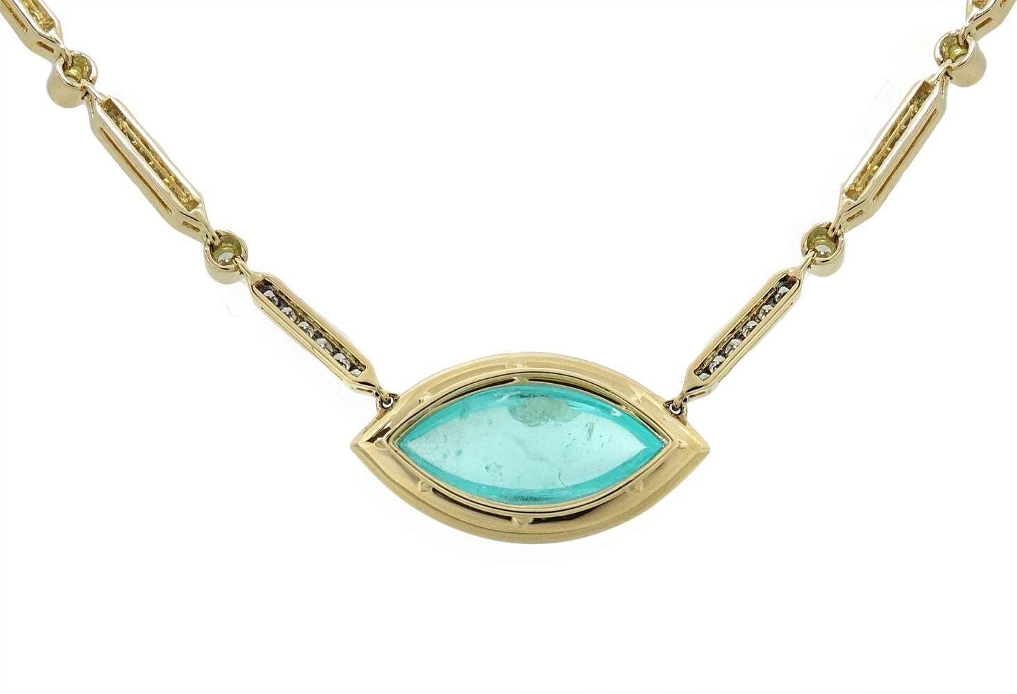 This Exceptional Pamela Huizenga 18K Yellow Gold Necklace Has A Stunning Marquise Shaped Paraiba Tourmaline In The Center Weighing A Total Carat Weight Of 15.32 Carats. Diamonds Outline The Light Blue Tourmaline and Links Of The Necklace Weighing A