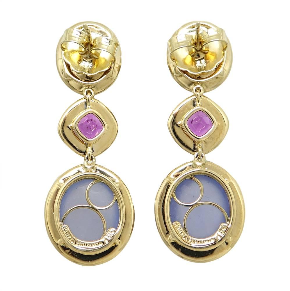 These Divine 18K Yellow Gold Pamela Huizenga Drop Earrings Have Gorgeous Oval Tanzanite Weighing A Total Carat Weight Of 7.96 Carats. Sparkling Purple Garnets Are Gently Set Next To The Tanzanite and Weigh A Total Carat Weight Of 3.23 Carats. Larger