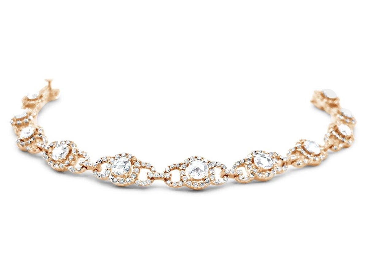 ~4.00ctw Vintage Style 18K Pink/Rose Gold with Rose Cut And Round Diamond Bracelet. Each link has a Rose Cut diamond surrounded by a Halo of full cut diamonds with addition diamonds accents making up a triple circular pattern.  There is a straight