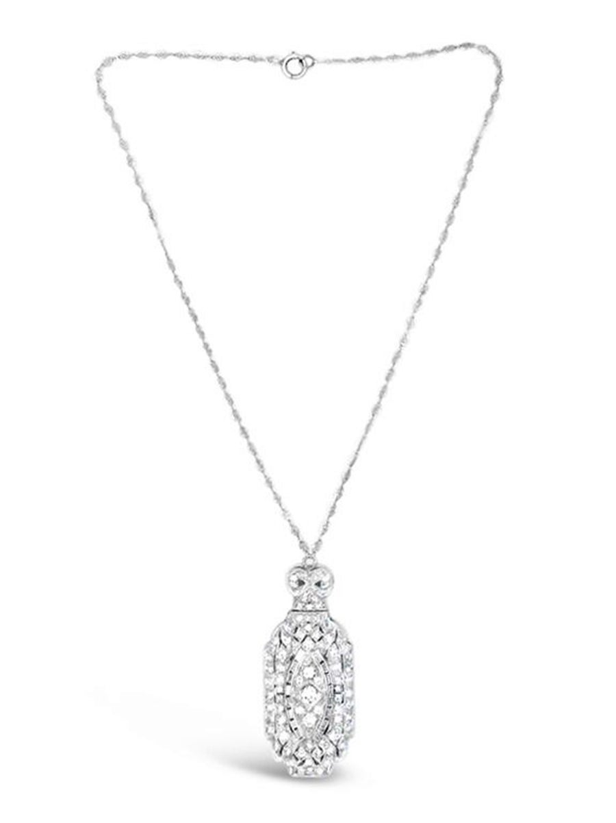 This Platinum Diamond Deco Necklace has 94 Round and Baguette Diamonds=~2.75Ctw. (G-I, VS-SI).  The upper section in hinged.  The Pendant is hanging on an 18K WG wire marquise scroll vintage style link chain 15
