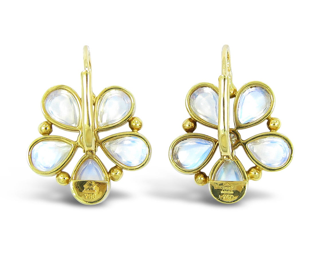 We are pleased to offer to you these beautiful Temple St. Claire Moonstone Flower Earrings. These earrings feature 5 Pear shape matching moonstones on each earring in the shape of a flower designed around a center round brilliant diamond, all bezel