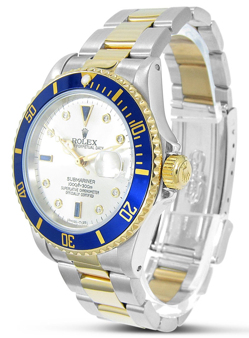 Up for sale is this 18K Yellow Gold and Stainless Steel Rolex Submariner with Blue Bezel/Silvered Serti Dial Circa 1984. 
Brand: Rolex Submariner 
Model Number: 16803 
Serial Number: 8607xxx 
Case Diameter: 40mm 
Dial: Slate sapphire and