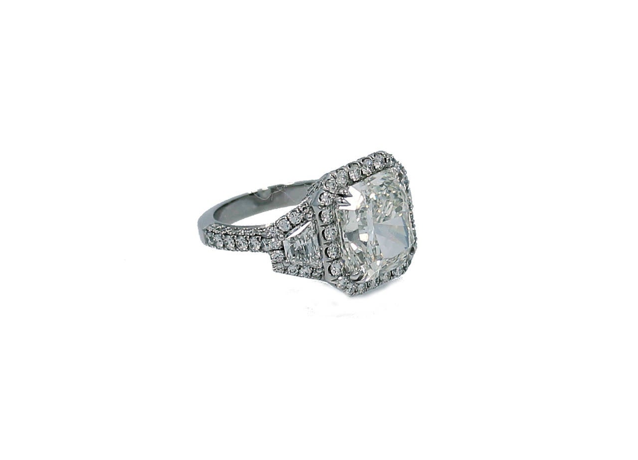 This magnificent engagement ring features a center 8.56CT Radiant  Diamond with GIA Report#17156663. The mounting is in Platinum with two side Trapezoid Diamonds=.89CT total weight and 186 round brilliant diamonds=2.15CT total weight . Absolutely