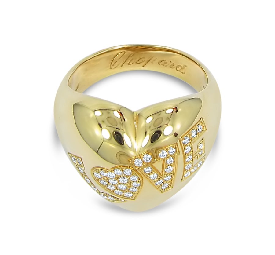 Show your affection with this 100% authentic Chopard 18k yellow gold and diamond LOVE ring. This ring is previously owned but in excellent condition. It has a beautiful polish and excellent quality diamonds. Approximately 0.25ct total diamond