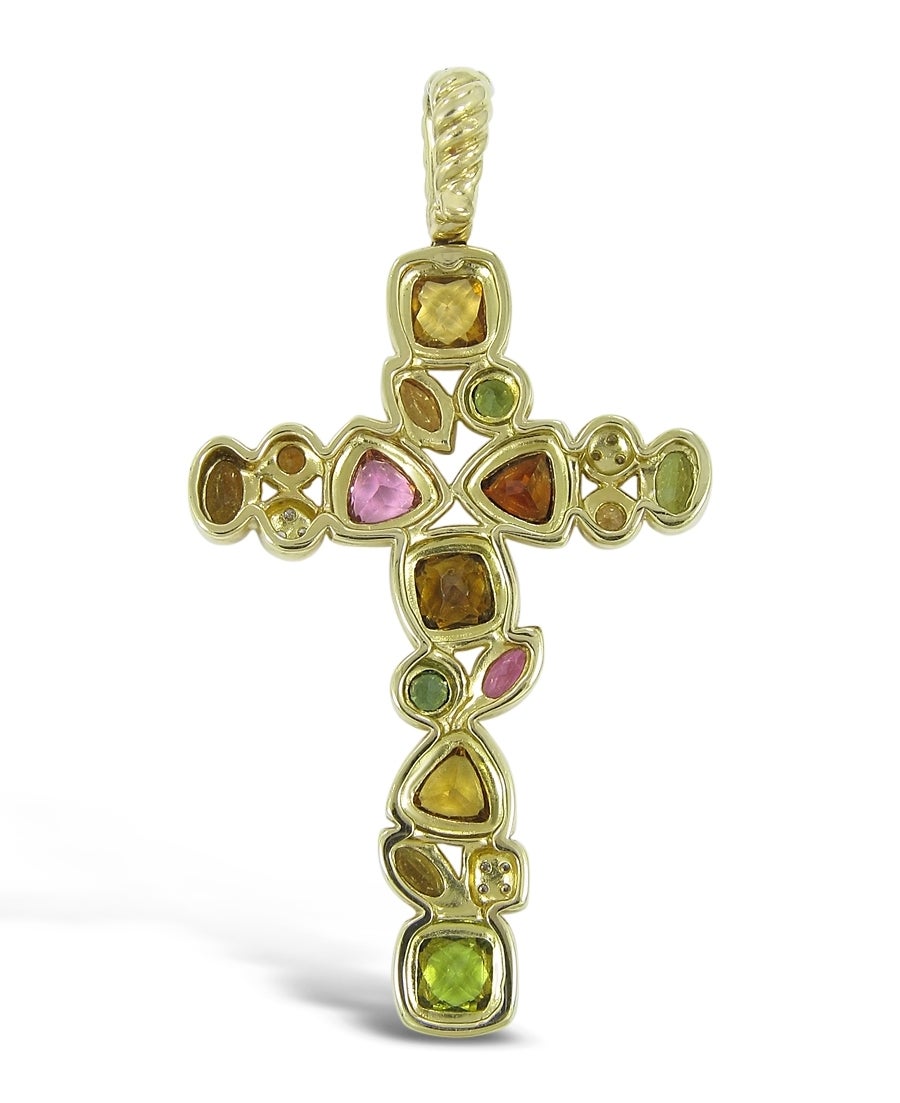 This David Yurman Cross has 15 colored gemstones of different colors, shapes and sizes all set in 18k yellow gold. There are also 10 round brilliant diamonds on this cross all prong set in the 18k yellow gold. The cross has a very easy to open bail