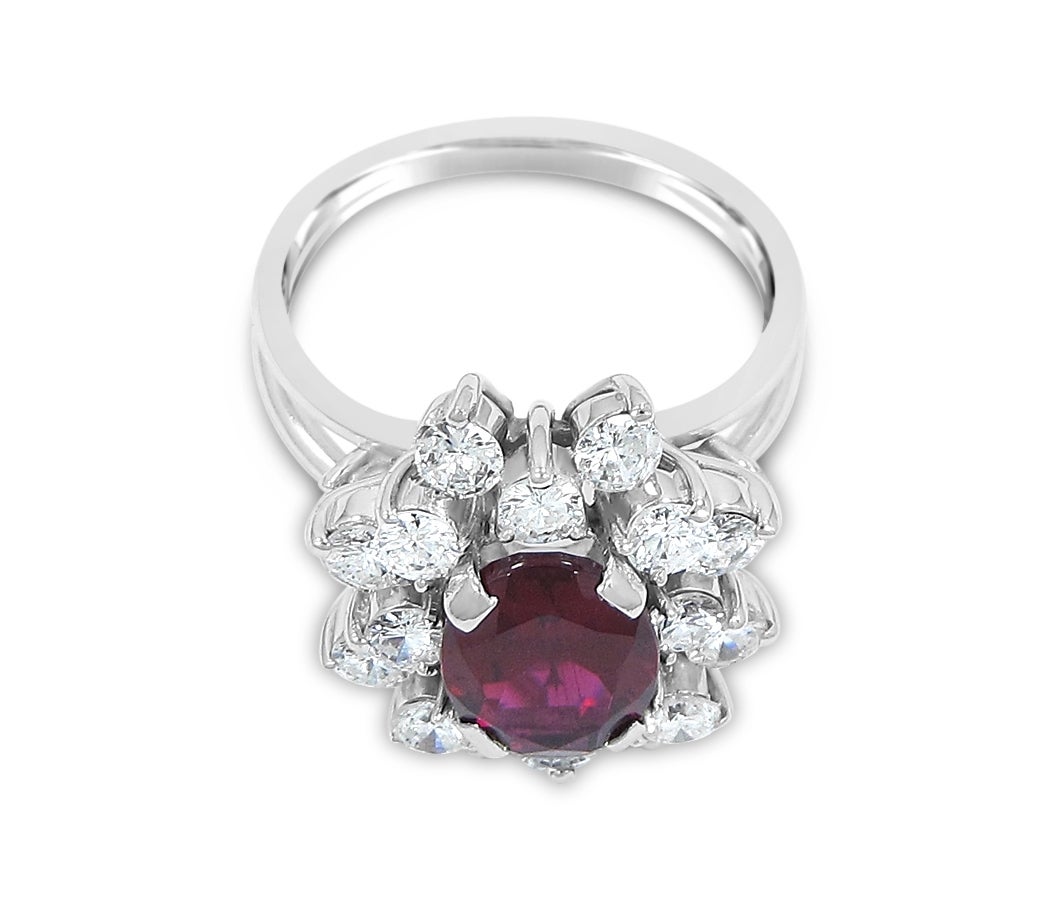 Here you have a beautiful pink tourmaline and diamond ring. Oval pink tourmaline is approximately 1.80cts. There are 18 round brilliant diamonds of great quality. Diamonds average .07 each and all stones are securely set in 14k white gold. Rings