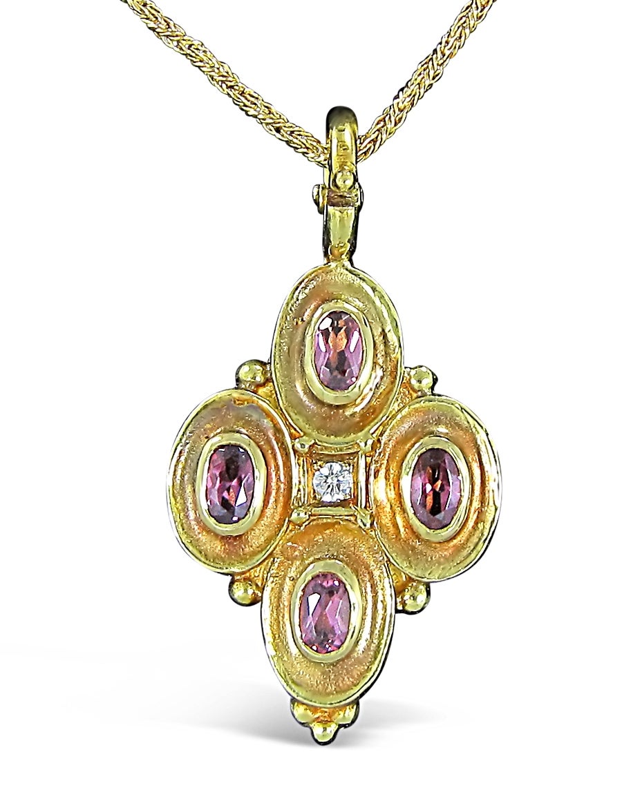 This Seidengang Necklace Enhancer / Pendant has one prong set round brilliant diamond at approximately .065cts and 4 oval pink tourmaline gemstones at 5.30mm x 3.50mm. each securely bezel set in 18k yellow gold. Enhancer bail is easy to open and