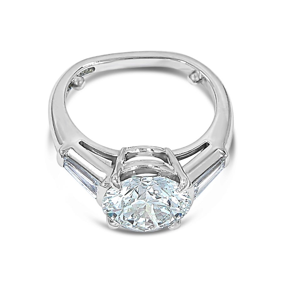 Here is an absolutely beautiful creation from Tiffany & Co.. Center diamond is certified through Tiffany & Co. The center diamond also has the Tiffany & Co. laser inscription for authentication, as you will see in the pictures.  Please let me know