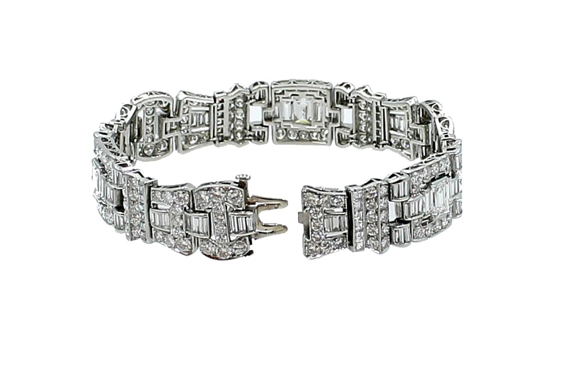 Platinum Art Deco Bracelet in excellent condition with 3 Emerald Cut Diamonds=2.36ctw, 186 round brilliant Diamonds=8.52ctw, 36 Square Diamonds=1.80ctw and 108 Baguette Diamonds=6.72ctw. Total Weight=19.50ctw
