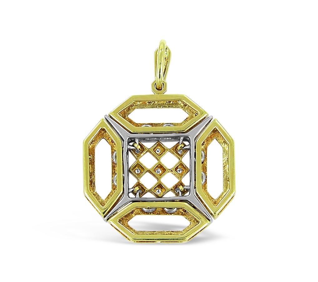 There are 50 round single cut diamonds approximately .01cts each, all securely prong set in 18k yellow gold. Each section is separated with 18k yellow gold bars. The design of this pendant gives it an ancient feel. Pendant is 1.19 x 1.19 inches.