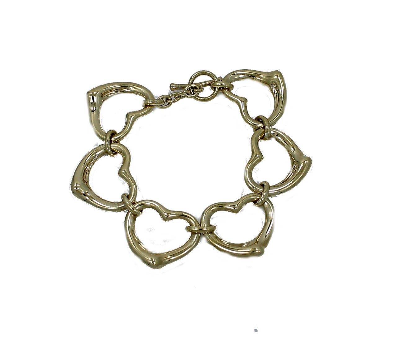 This is a beautiful Elsa Peretti designed for Tiffany & Co. Heart bracelet in yellow gold. The bracelet is 7