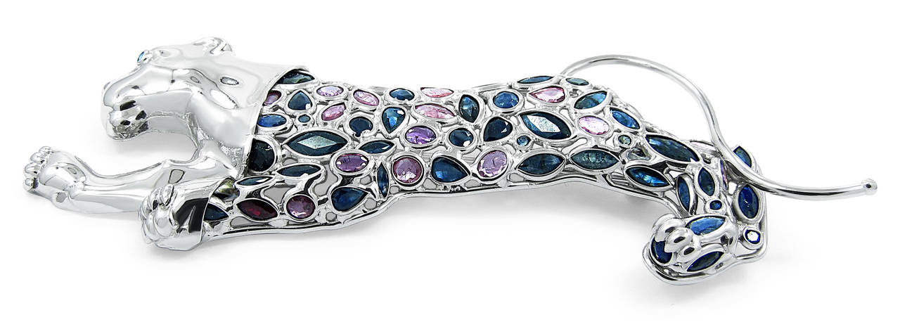 This well crafted Panther Brooch by BAGA holds 71 sapphires mixed of blue and pink in color with different sizes and shapes, all securely bezel set in 18k white gold.