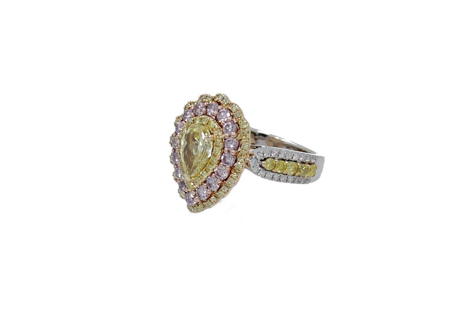18K Yellow and Gold Ring with 1.05 carat Natural Pear Shape Fancy Intense Yellow (GIA Report#2105909286) center, 89 round brilliant yellow diamonds which equal .76 carats total; 16 Round Brilliant Pink Diamonds which equal .75 carats total;  and 38