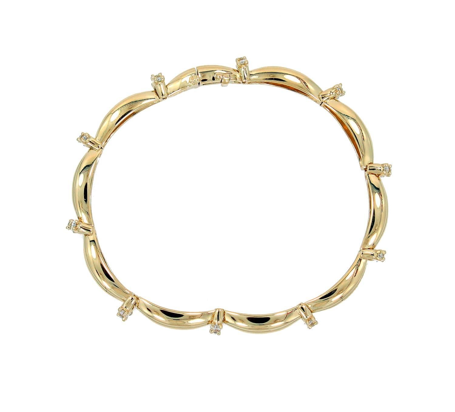 18K Yellow Gold Tiffany & Co. Bracelet with Diamond Links. This beautiful bracelet is 7 inches long and has an approximate 1.50 carats is diamonds. It is signed T&Co. Circa 1992. In new condition. 