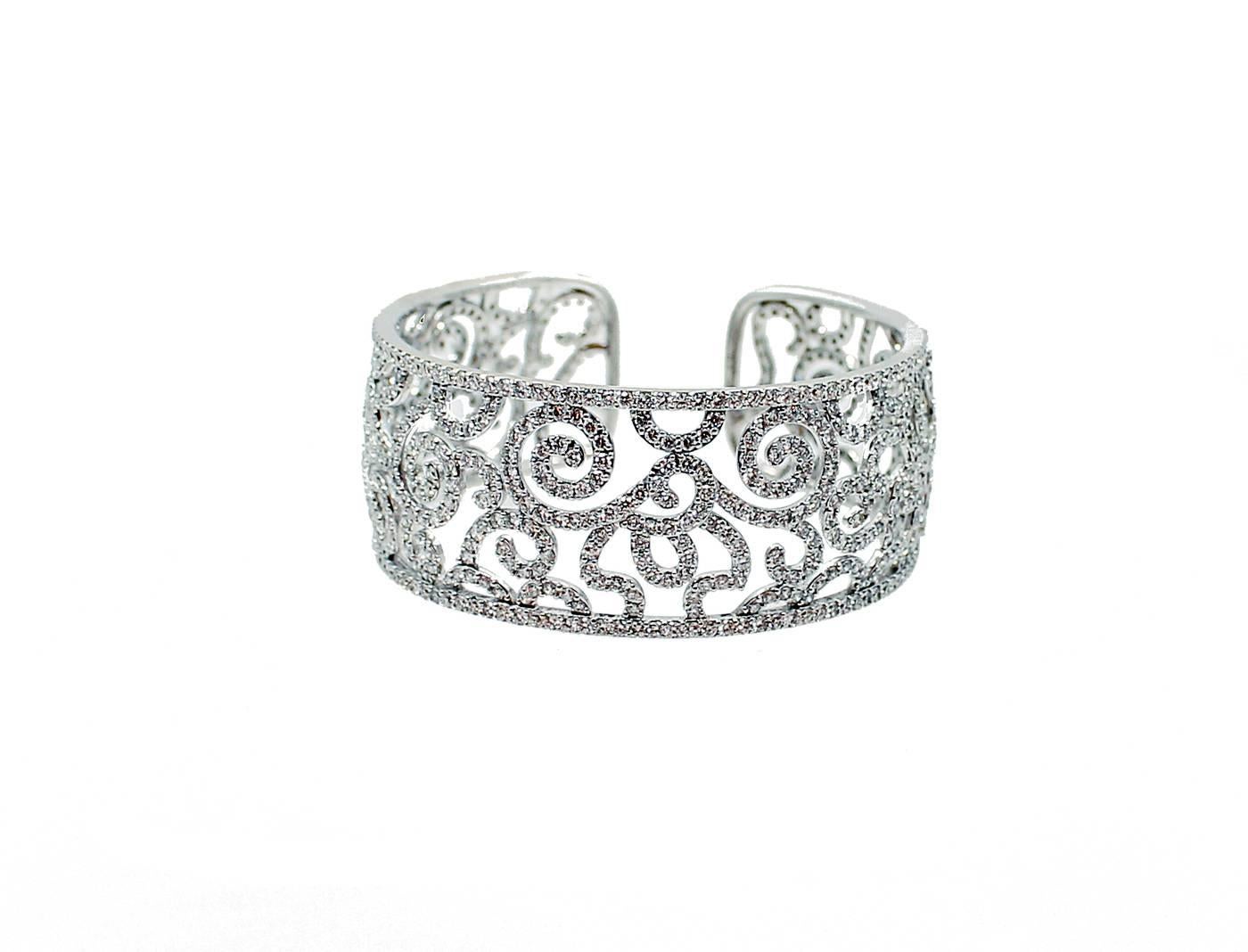 18K White Gold Cuff Bracelet with 13.81 Carats in Diamonds G-H in color and VS2-SI1 Clarity. 