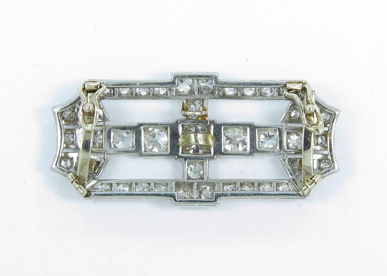 This beautiful vintage platinum and 14k yellow gold slide pendant has approximately 3ctw. There are 43 old mine cut diamonds with the center diamond at approximately .40cts. This slide will fit a chain or omega with a width of around 7mm. Entire