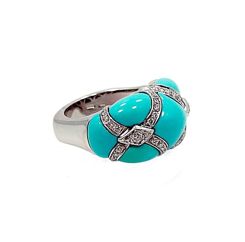 18K White Gold fashion Ring with Turquoise and 42 Round Brilliant Diamonds which equal a total .50 carats and they are G-H in color and VS in Clarity. The ring is a size 7.5. 
