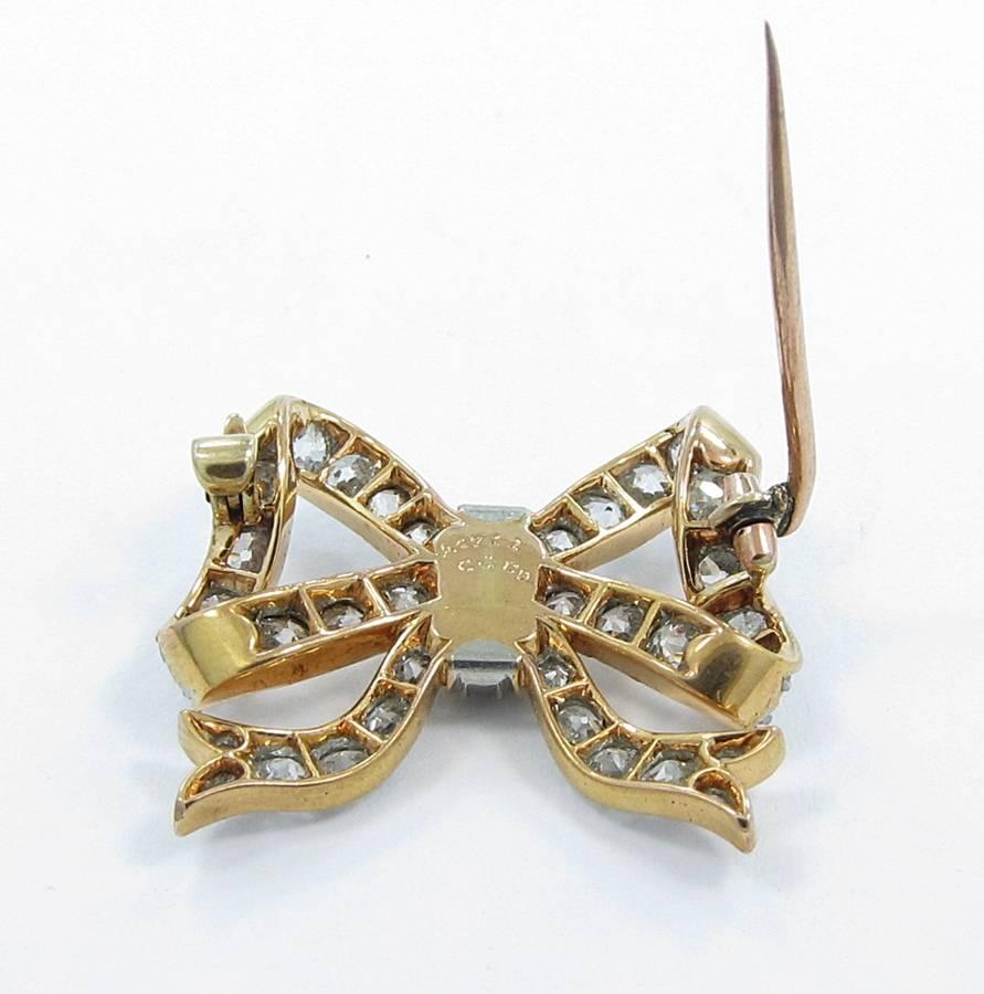 C&Co. Diamond Gold Platinum Bow Pin In Excellent Condition For Sale In Naples, FL
