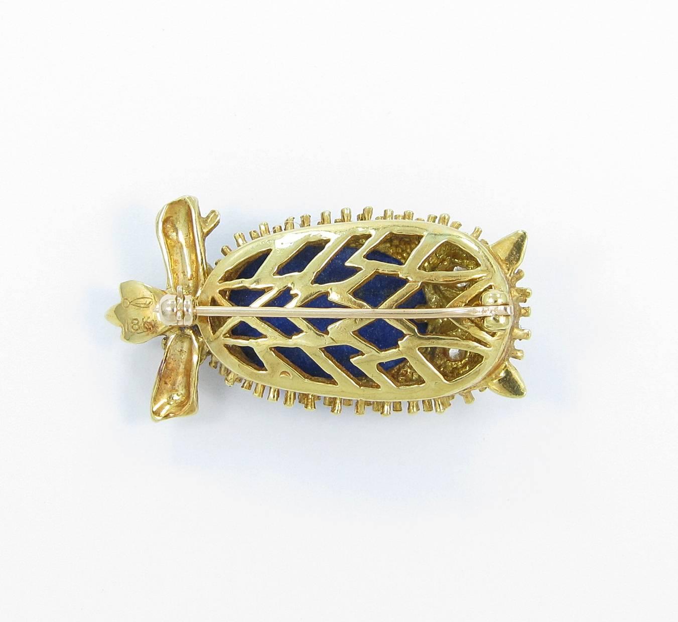 This 18k yellow gold owl pin hold 2 round brilliant cut diamond eyes that are approximately .08cts each with great color and clarity. Lapis measures 18mm x 13mm with a depth of around 6mm. Owl measures 1.50inches from head tail and .75inches from