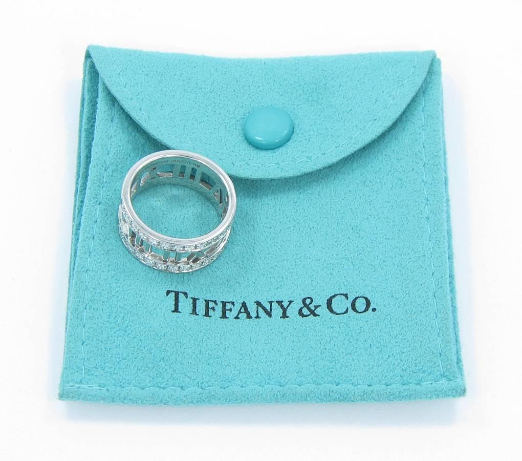 Tiffany & Co. Atlas Open Ring with approximately .60cts of round brilliant cut diamonds set in 18k white gold. Ring is in excellent condition with only very minor scratches that can be buffed out. Ring sits at a size 6. Tiffany & Co. retails this