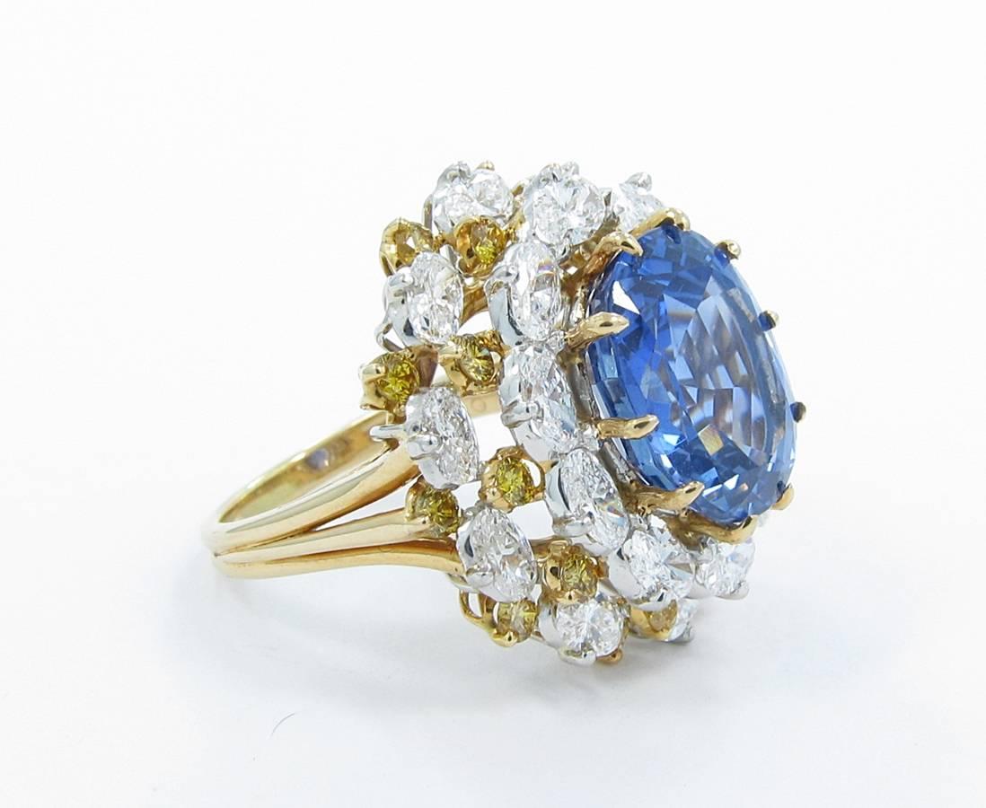 This beautiful Oscar Heyman ring holds a 12.16ct Natural, No Heat Ceylon (Sri Lanka) oval shaped sapphire with an AGL Report. Surrounding this magnificent sapphire are 4.30ctw of Oval F VS+ diamonds and 1.24ctw of round brilliant Fancy Intense