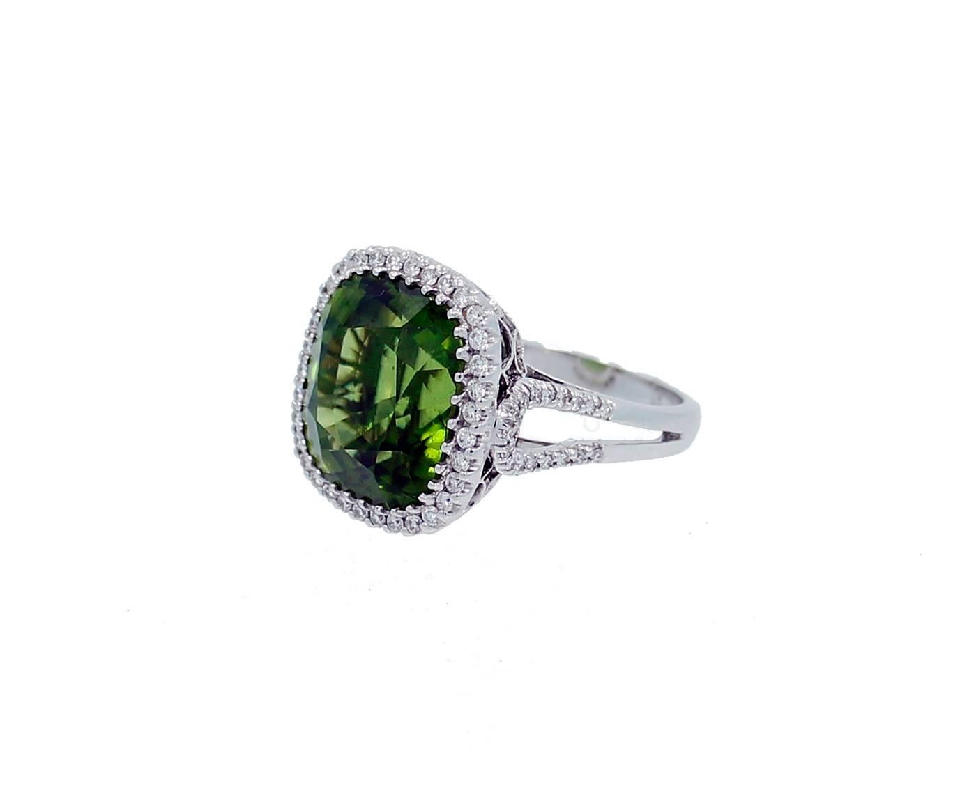 18K White Gold Ring with Center Burmese Peridot which weighs 16.71ct and 68 Round Brilliant Cut Diamonds weighing a total of .58 carat's G-H in Color and VS2-SI1 in Clarity. The ring is a size 7. Can be sized.