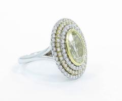 3.12 Carat Fancy Color Oval Diamond Gold Triple Halo Ring