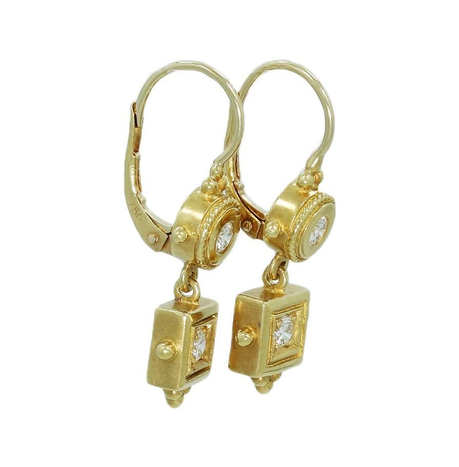 These beautiful Penny Preville Diamond Earrings hold 4 round brilliant cut diamonds that equal approximately .40cts total weight. Each diamond is securely prong set in the 18k yellow gold mountings. The bottom part of the earrings sways back and