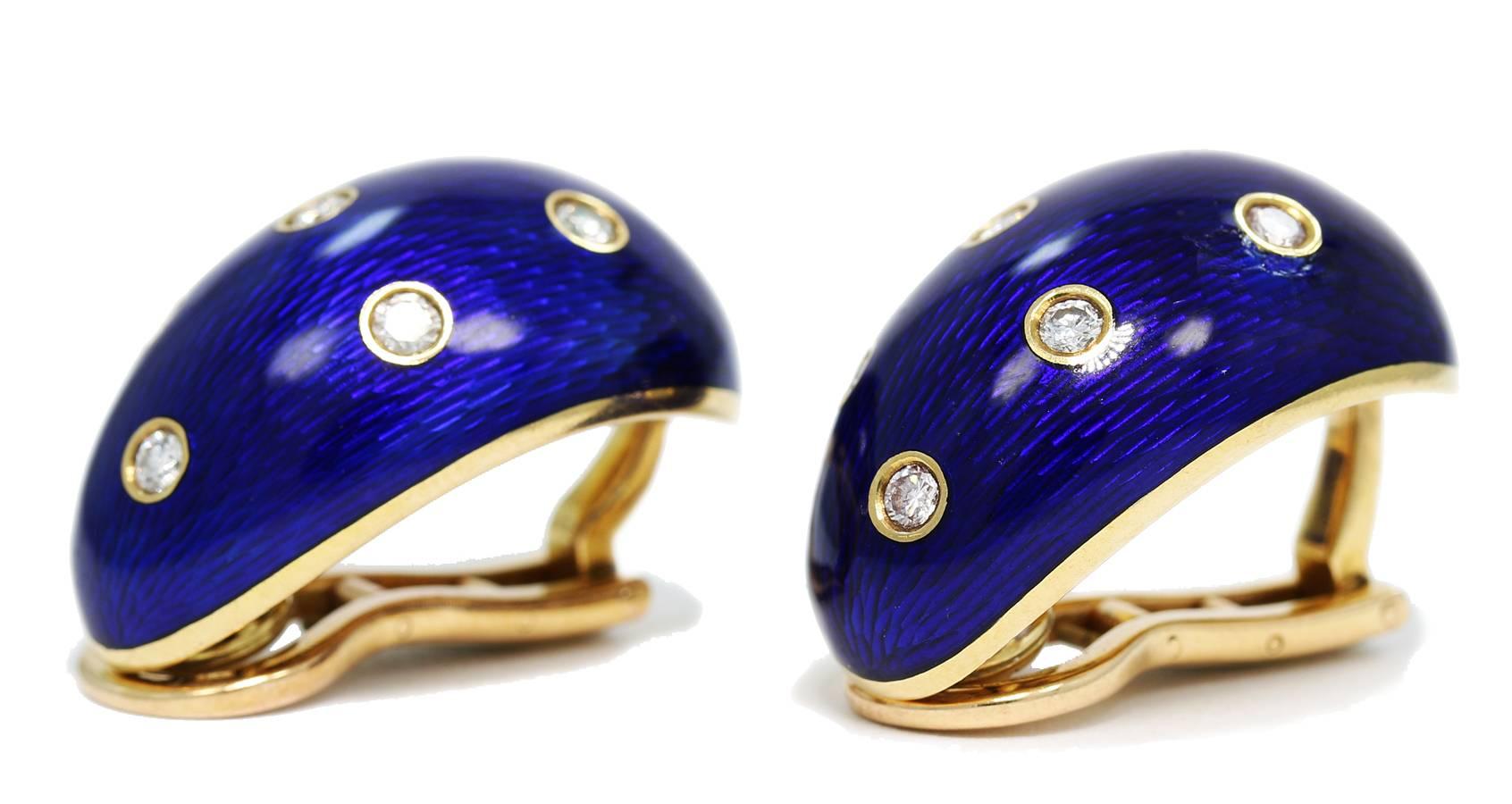 These estate Cartier earrings are absolutely beautiful. These are larger earrings created in 18k yellow gold with blue enameling and approximately .70cts total diamond weight of round brilliant cut diamonds. All diamonds are bezel set. There is a