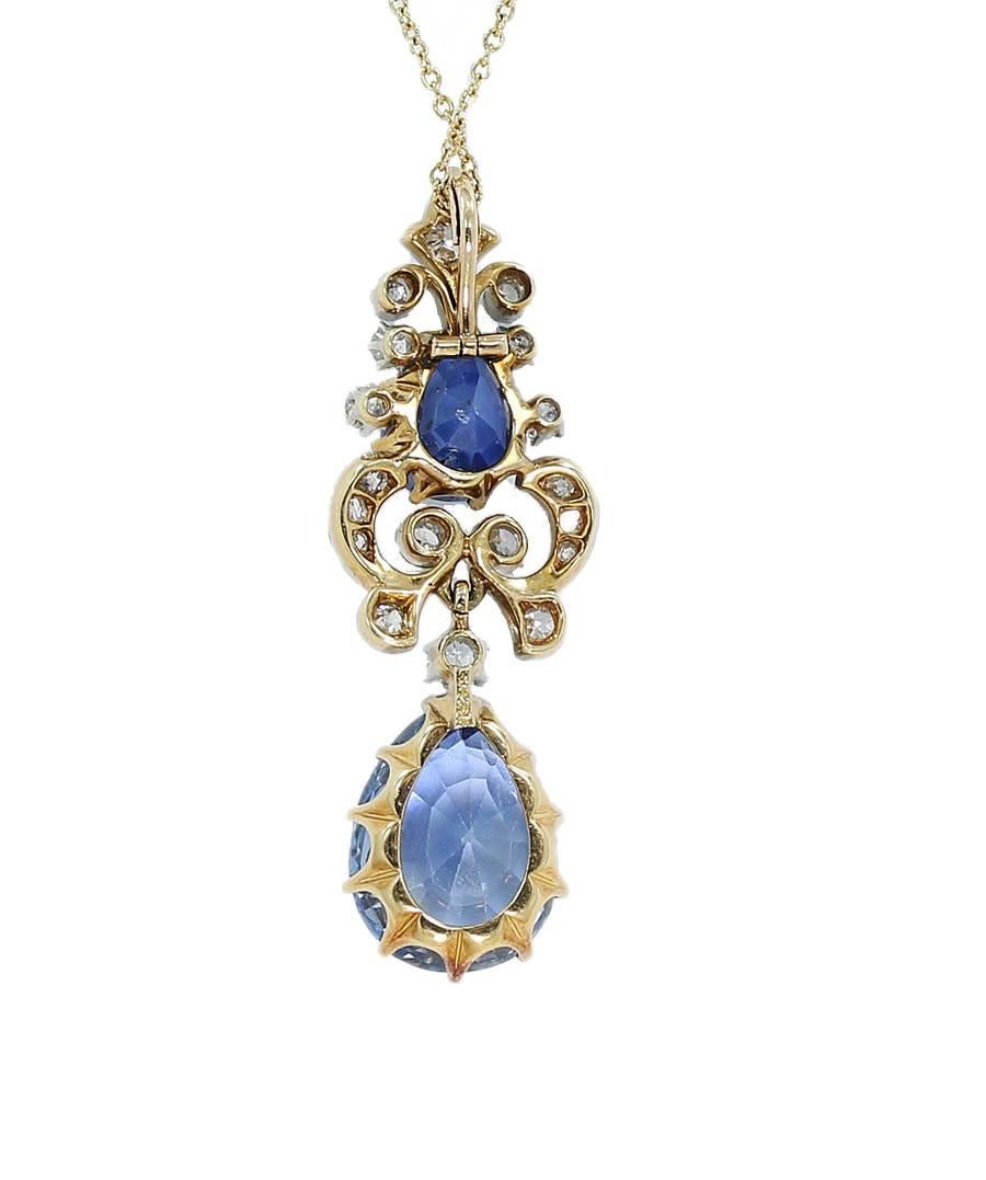  Black, Starr & Frost Victorian Sapphire and Diamond Pendant/Necklace. The pendant holds two pear shape sapphires. The bottom sapphire starts out with a blue color on top and then moves into a yellowish glow at the bottom, it measures 13.50mm x
