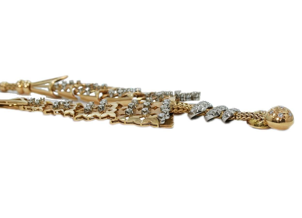 Up for sale is this beautiful platinum and 18k yellow gold necklace. This is a very fashionable necklace. There are approximately 6.00cts of round brilliant cut diamonds scattered around this necklace. The chain that connects this necklace together