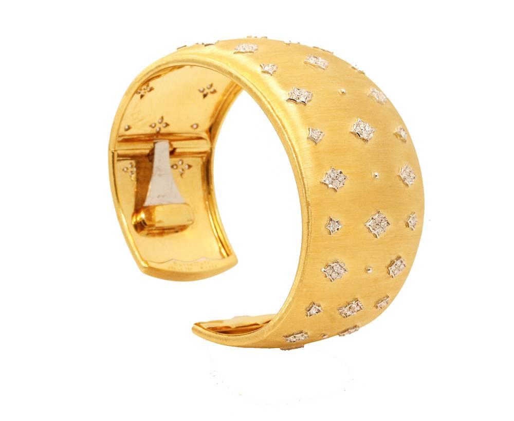 18K Yellow and White Gold Buccellati Hand Made 3.5cm  Cuff Bracelet with 114 Round Brilliant Dimaonds which equal a total of 1.79 carats. This Buccellati Cuff  is Marked: Buccellati  Italy 18K  and has never been worn.