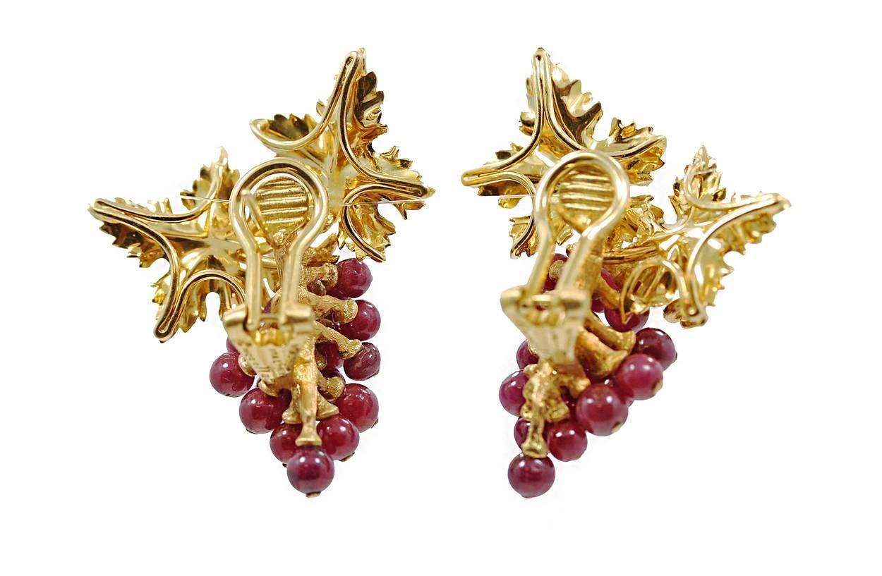 18K Yellow Gold Buccellati Grapevine Earrings with Fancy Carved Rubies weighing a total of 16.58 carats. These earrings have never been worn, Signed Buccellati Italy and hand made. Come in original box. Rare find