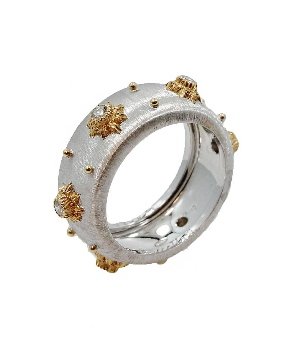 Buccellati Macri Band in 18K Yellow and White Gold with 6 Diamonds equal to .24 carats. This handmade piece has never been worn and is a size 6.75. 