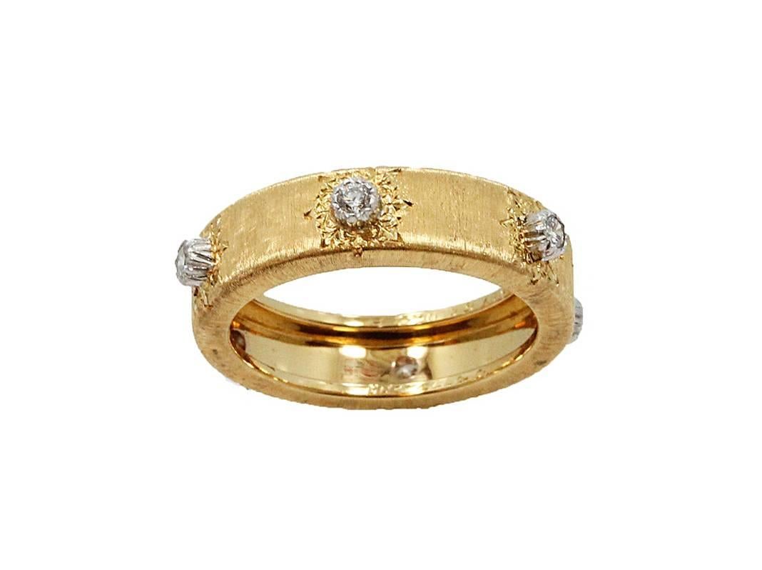 Buccellati Classica Band in 18K Yellow and White Gold with 6 Round Brilliant Diamonds which equal to .20 carats in total weight. The band is size 6.75 and has never been worn. 