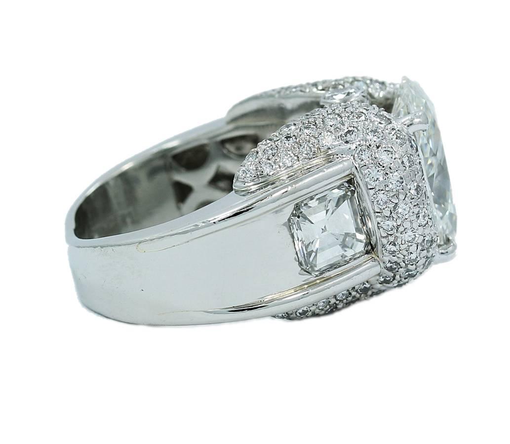 Up for sale is this amazing Charles Krypell Engagement ring. This ring holds a 5.02 Oval Diamond (GIA Report 7150755) with VS2 in Clarity and H in color. On the sides of the ring are square emerald cut diamonds with the following GIA Reports: 1.06ct