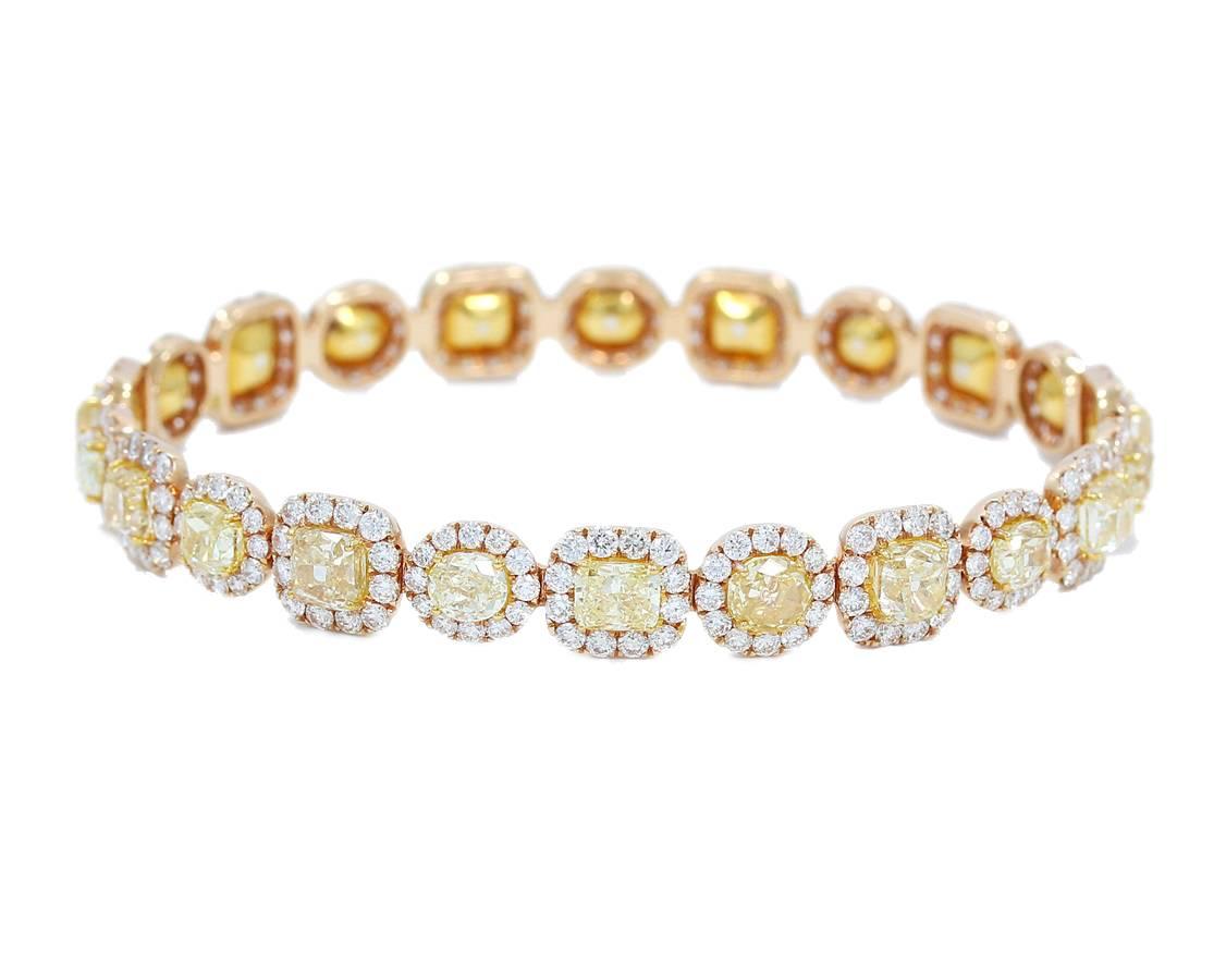 Up for sale is this beautiful 18k rose gold bangle bracelet. There are 16.36cts tw of fancy yellow diamonds and 6.36cts tw of round brilliant cut diamonds. Inside diameter of this bracelet measures 2.50