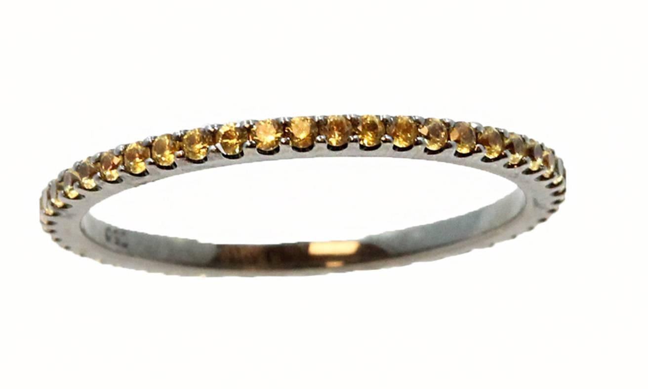18K White Gold Eternity Band With 50 Yellow Sapphires With a Total Carat Weight of 0.52. In a Size 6.5.
