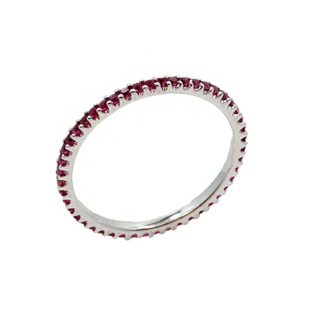 18K White Gold Eternity Band With 50 Rubies With a Total Carat Weight Of 0.52. In a Size 6.5.