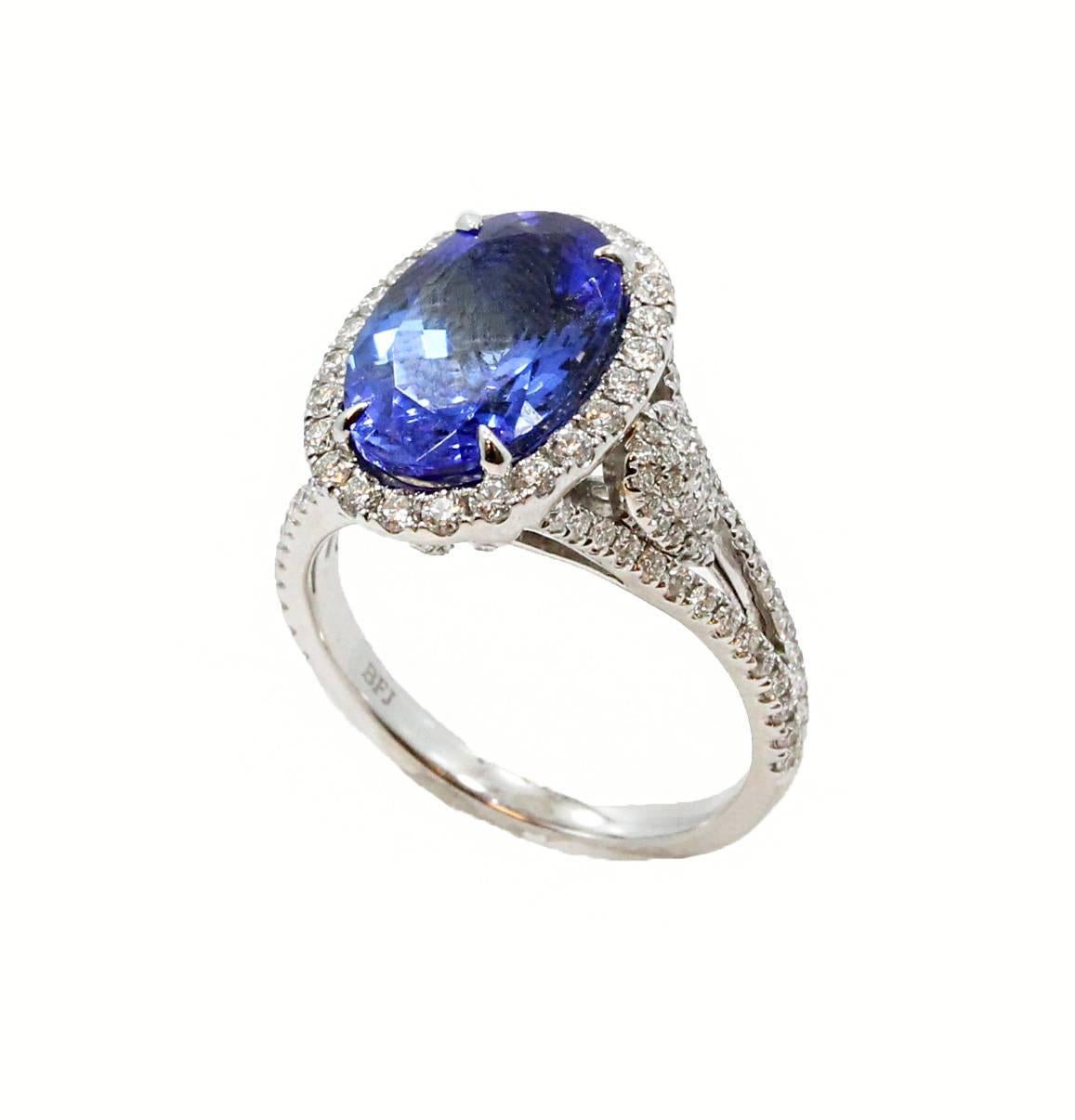 18K White Gold Ring With Center Tanzanite Oval Stone Weighing 4.79ct and Diamonds Weighing .35ct In a Size 6.5