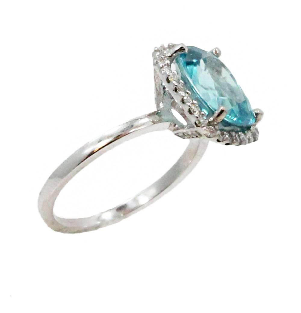 14K White Gold Ring With Center Blue Zircon Weighing 5.88ct and Diamonds Weighing 0.40ct In A Size 8